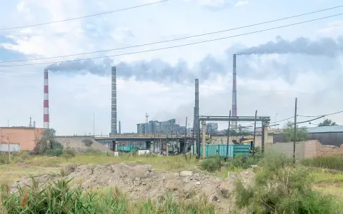 Copper smelting plant in Balkhash: chimneys behind a bridge