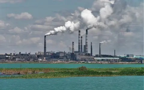 Copper smelting plant in Balkhash: factory chimneys on the lake shore