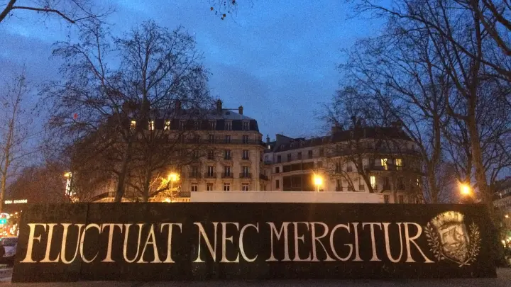 The words Fluctuat nec mergitur on Place de la République in Paris