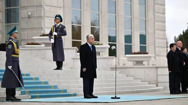 Tokayev at the State Flag raising ceremony outside the Akorda
